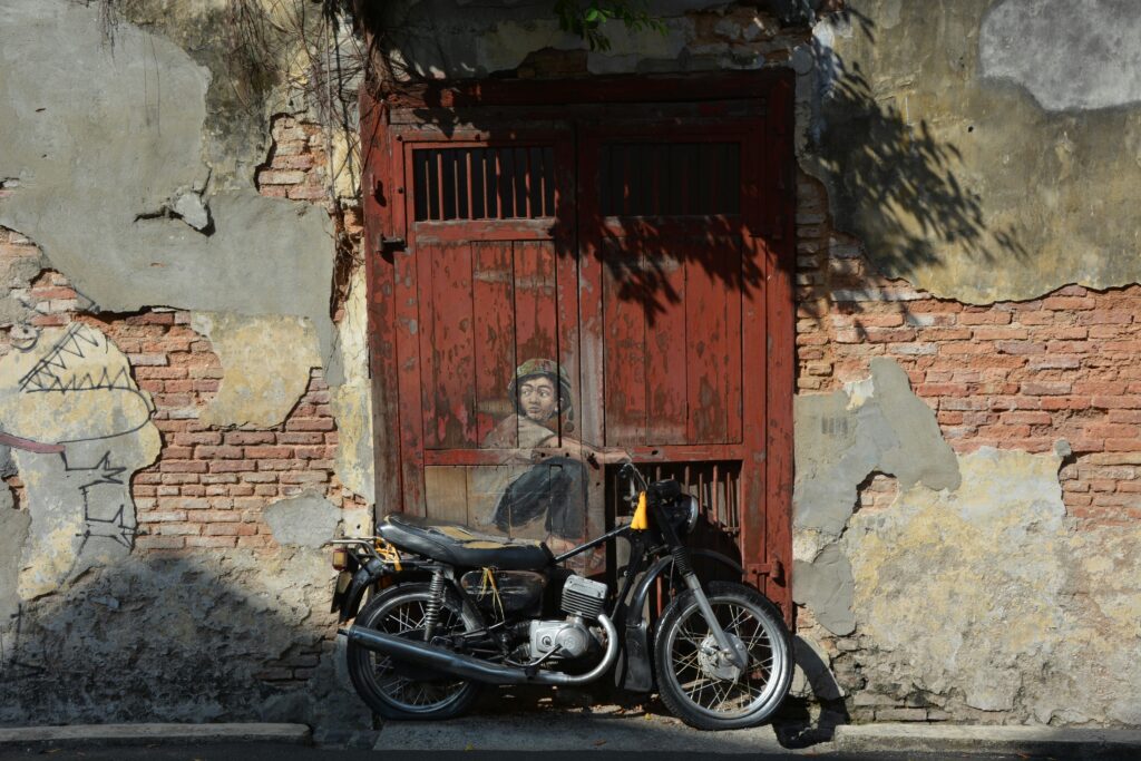 Street art mural with motorbike in George Town, Penang Malaysia